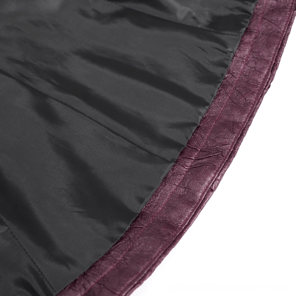 Interior close-up showing smooth black satin lining with purple leather edge trim of gothic jacket