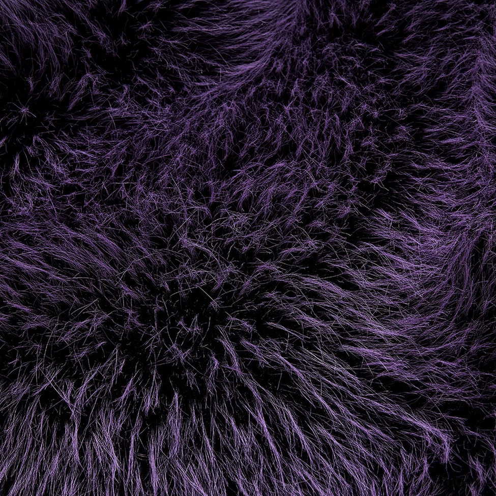 Close-up texture detail of dark purple shaggy faux fur with black fuzzy tips on gothic jacket