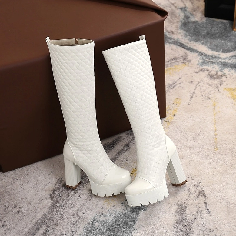 Close-up texture of quilted PU leather on gothic platform boots with stitch detail