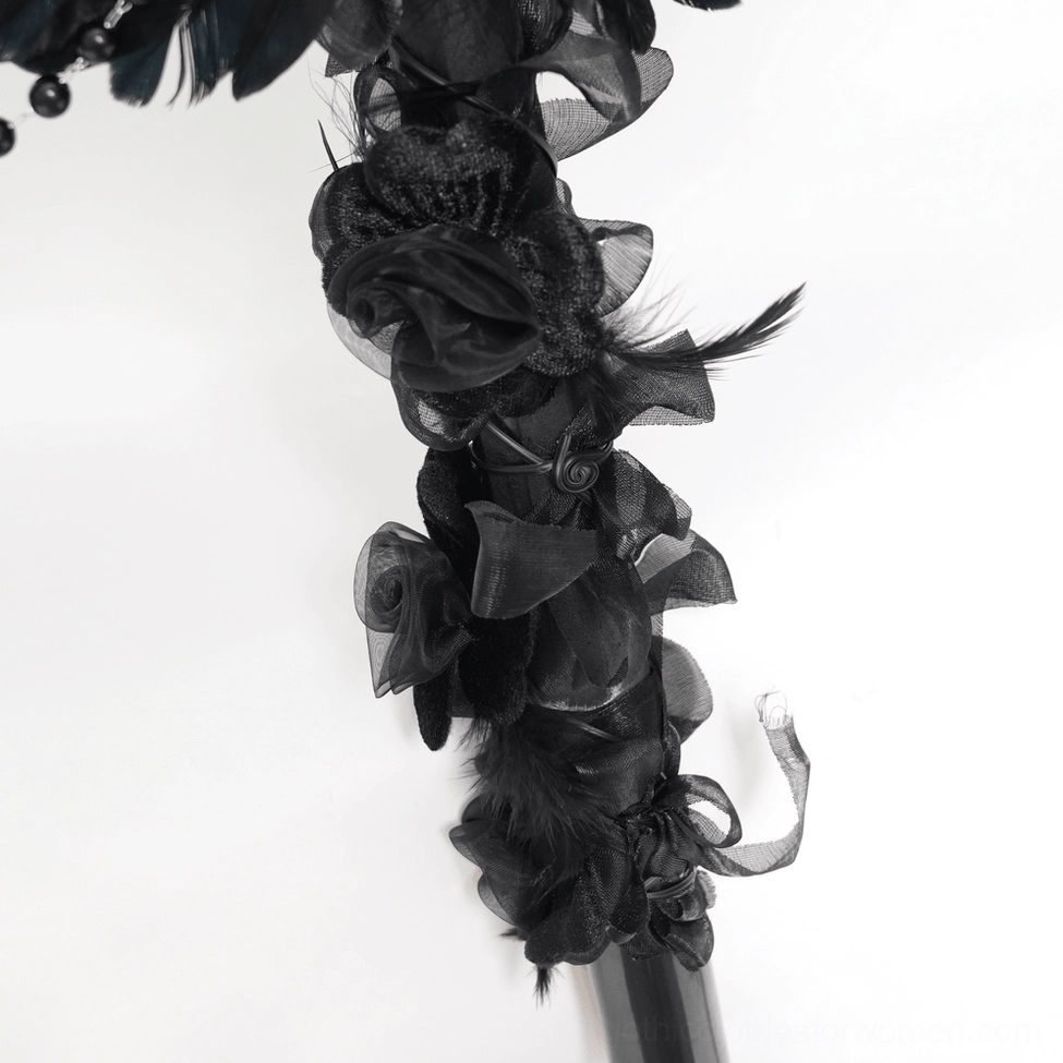 Full-length black raven cross ritual staff showcasing dangling chains, feather details, and rose embellishments