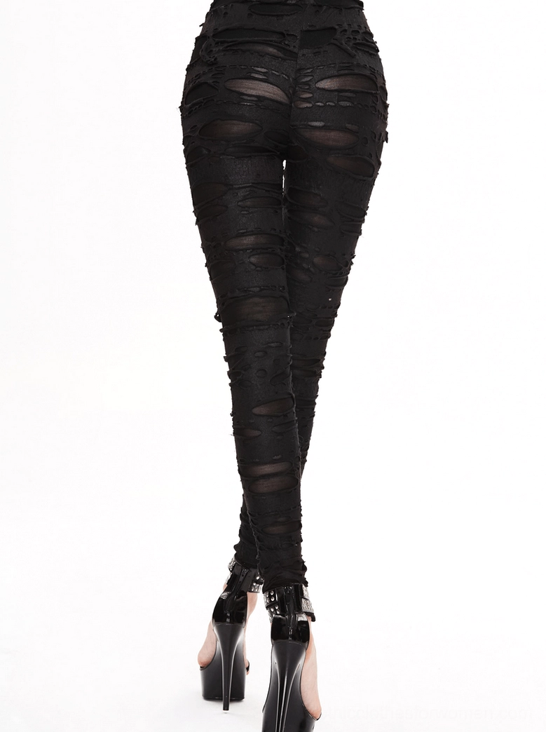 Rear full view of gothic high-waist ripped pants showing sheer mesh under distressed layers with platform heels
