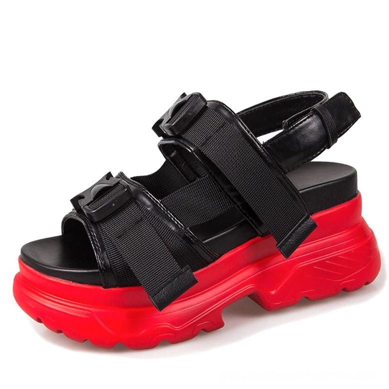Red and black platform sandals with open-toe design and textured rubber sole, goth aesthetic