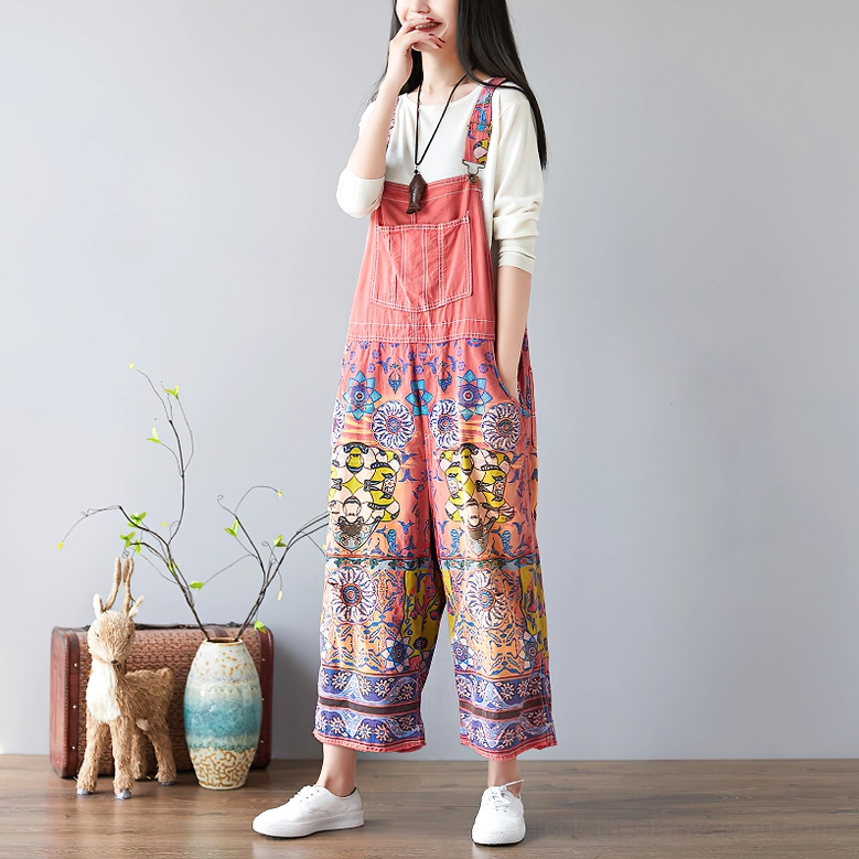 Coral red ethnic floral print wide-leg gothic pants three-quarter side angle showing cropped leg opening