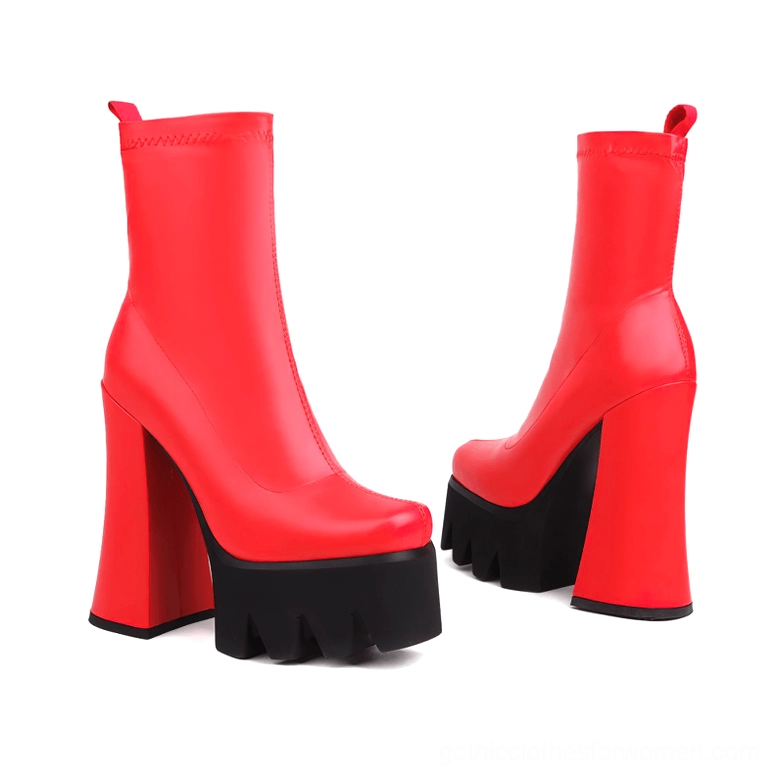 Red genuine leather gothic platform boots pair from angled side perspective with industrial serrated sole