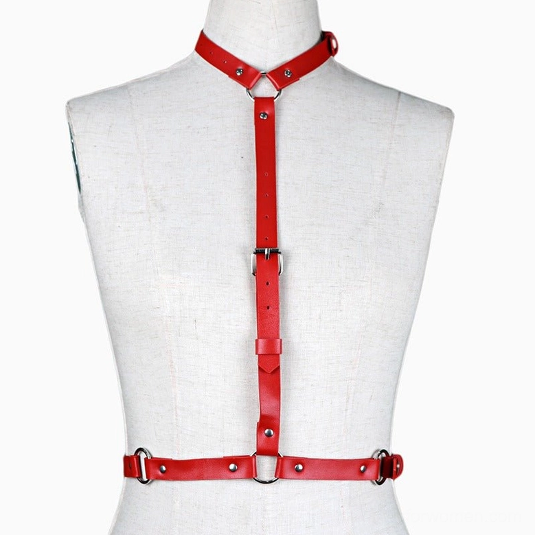 Red leather body harness with vertical adjustable straps displaying smooth leather texture on mannequin, front detail view