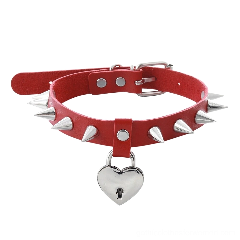 Red heart spiked choker with silver spikes and padlock detail, flat lay view of gothic leather collar