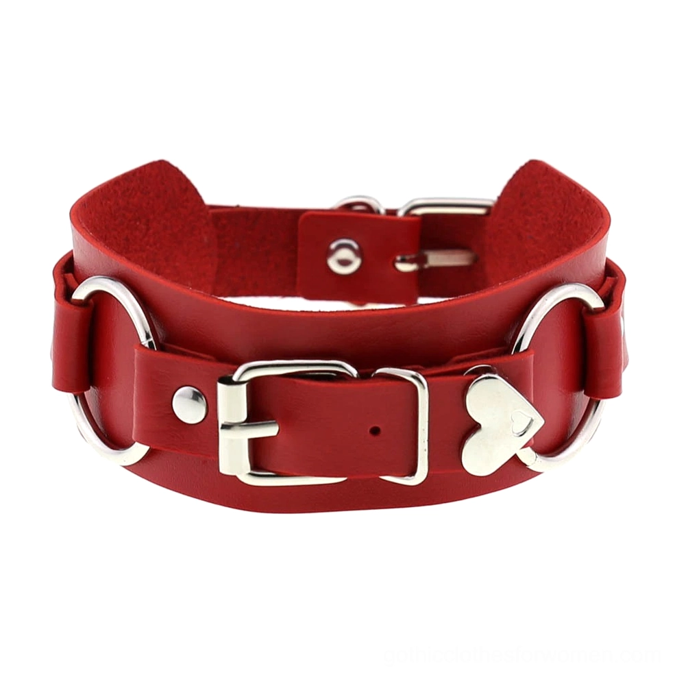 Red leather choker with heart accent and silver metal hardware, bold gothic statement piece