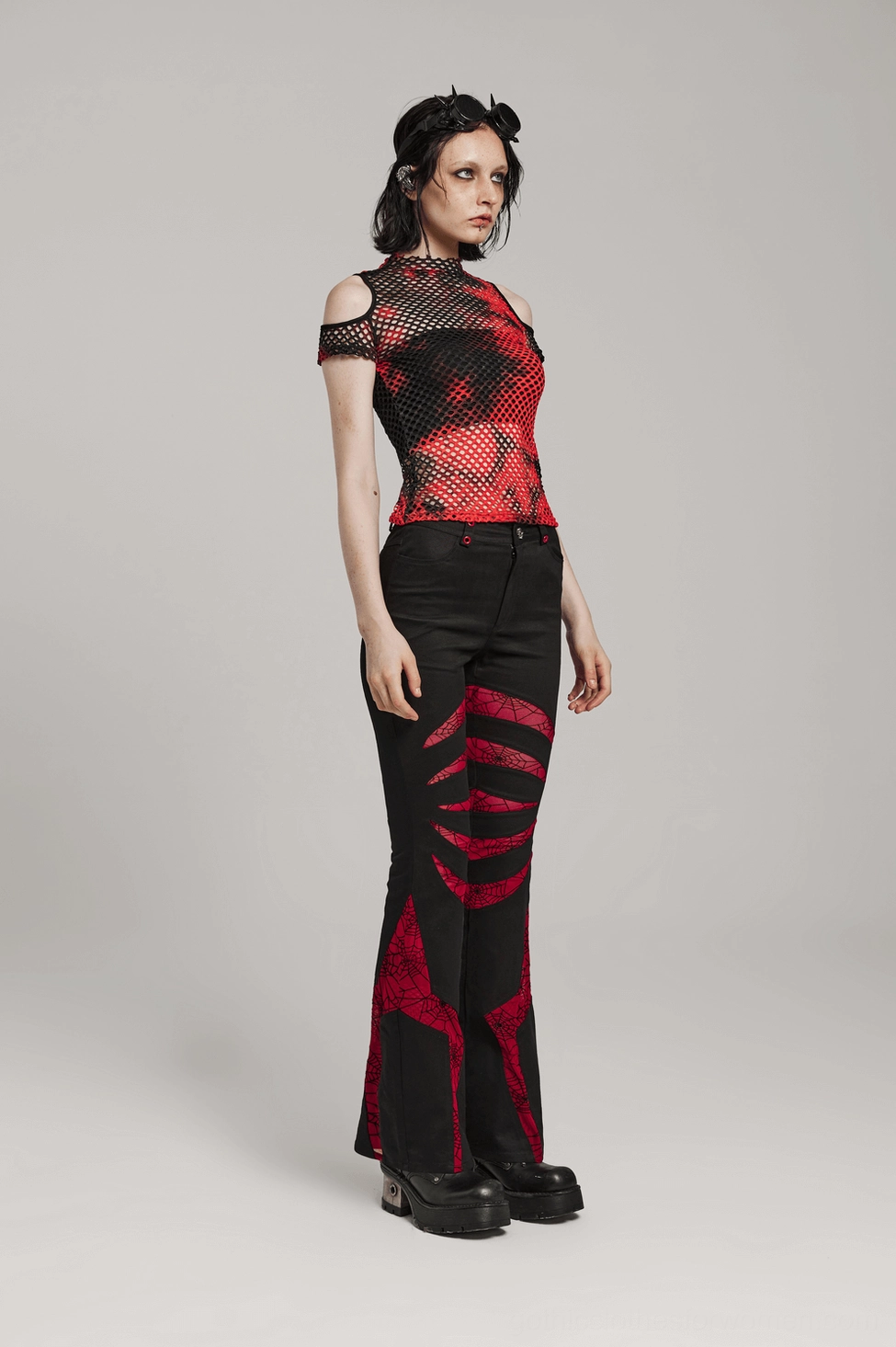 Red spiderweb mesh panel detail on black gothic flared pants leg insert