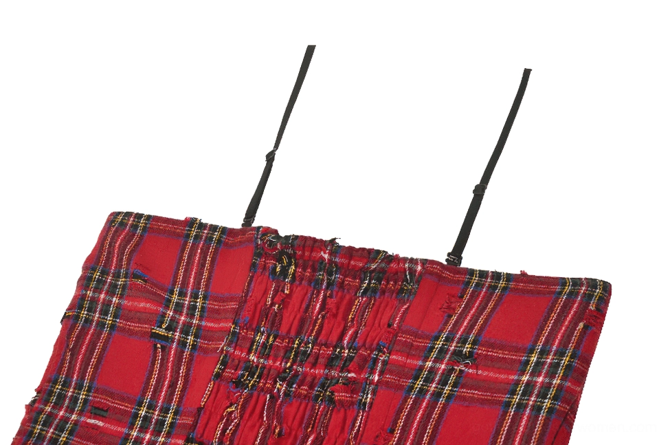 Detailed close-up of shirred ruched bodice and thin spaghetti straps on red plaid corset dress