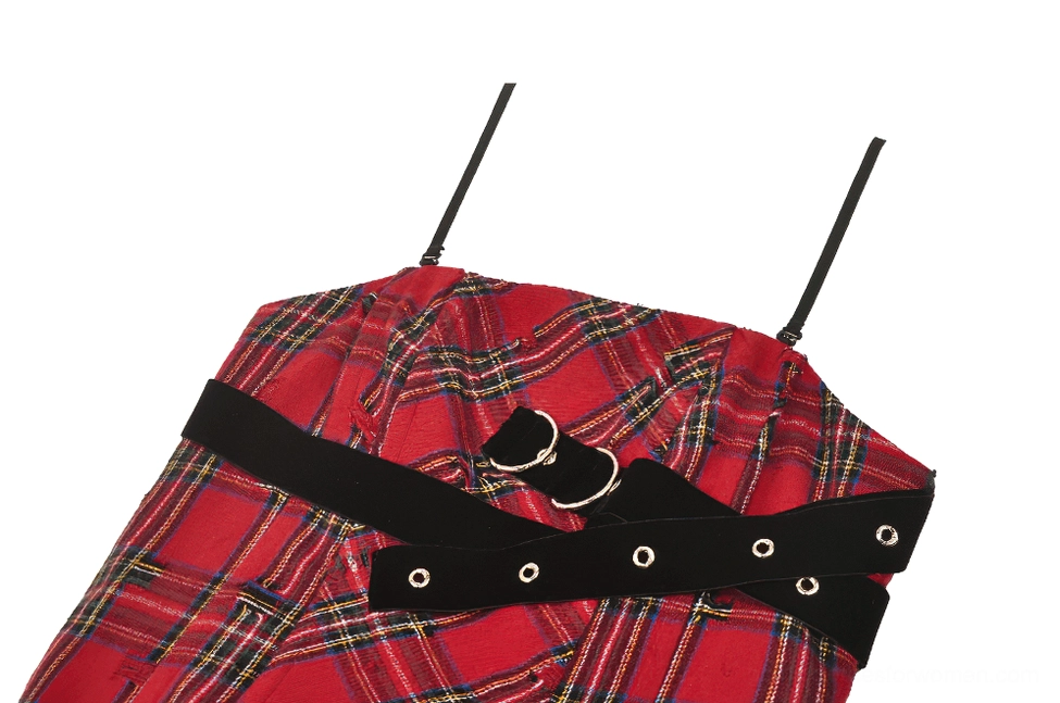 Close-up detail of crossed black leather buckle straps on red plaid corset dress