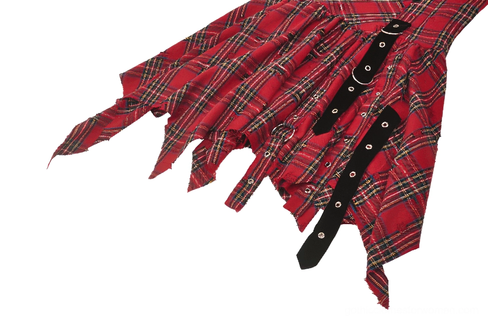 Close-up side view showing irregular torn hem and multiple black buckle straps on tartan dress