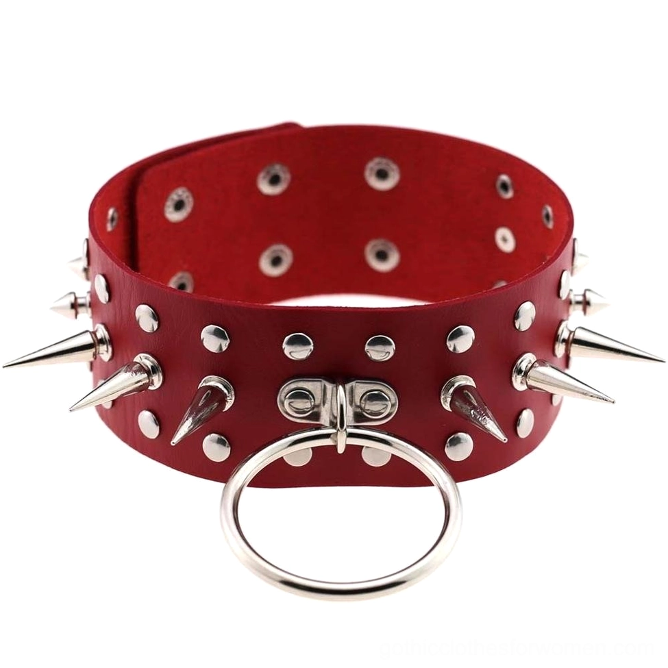 Red spiked faux leather choker with metal studs statement gothic necklace flat lay display
