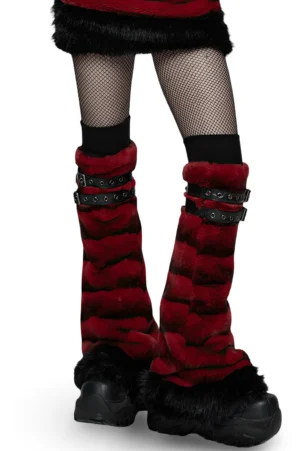 Pair of red striped gothic fur leg warmers flat lay, front view displaying black double buckle straps, black fur hem trim, and black ribbed knit cuffs on white background