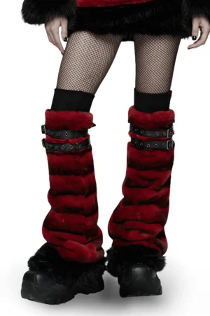 Red striped gothic fur leg warmers styled with fishnet stockings and platform boots on female model, front low-angle view showcasing striped plush fur texture and adjustable buckle straps