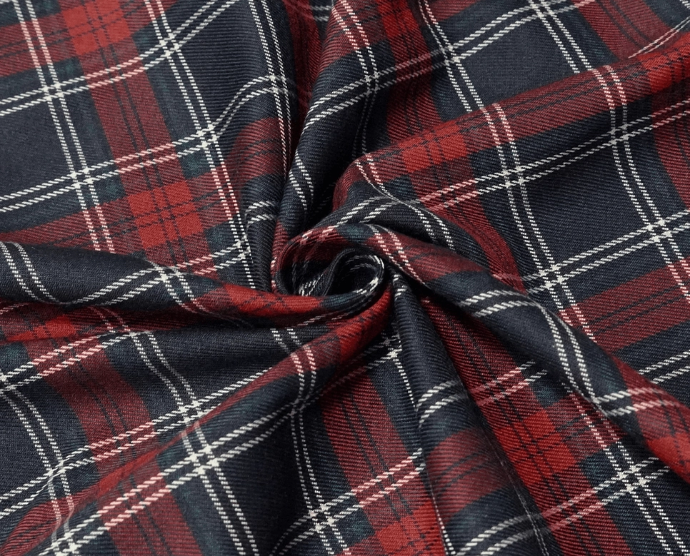 Red tartan gothic chain skirt on model, demonstrating alternative fashion styling and movement