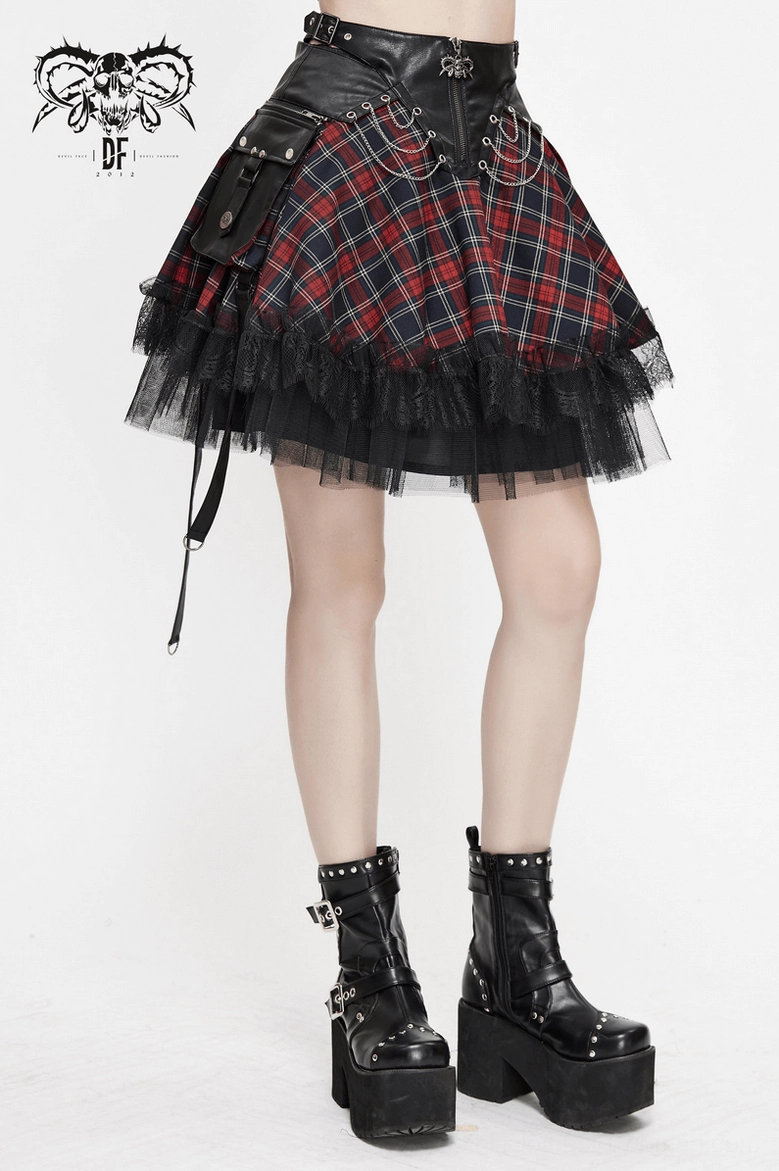 Side profile of red tartan gothic chain skirt showing silhouette and mesh panel construction