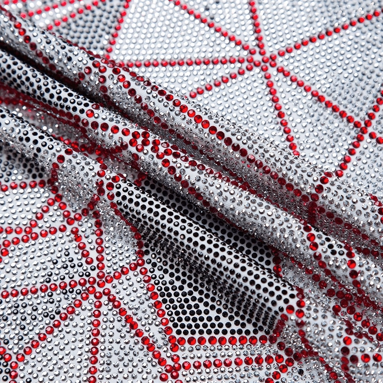Red and silver rhinestone stitching on stretch knit base fabric of gothic graphic tee