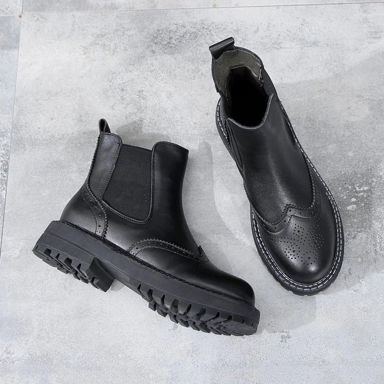 Round toe Chelsea boots with genuine leather upper and professional gothic elegance