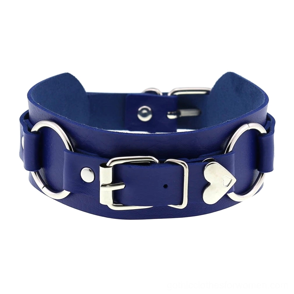 Royal blue leather choker with silver metal fittings and heart charm, wide leather design flat lay