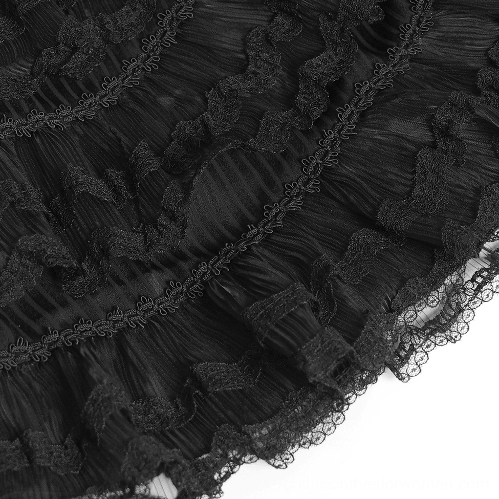Detailed view of ruffled bell sleeves with ribbon tie closure on black Victorian lace blouse