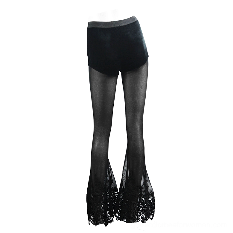 Sheer black mesh flare pants with floral lace hem, front three-quarter view on model with platform heels