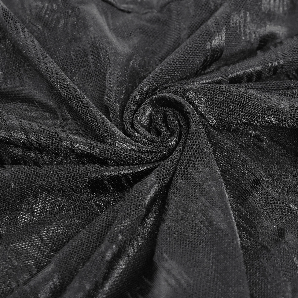 Sheer mesh fabric texture close-up with tie-dye print pattern