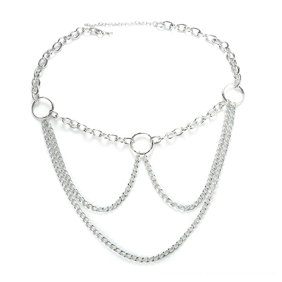 Silver layered chain belt flat lay photography, displaying intricate multi-strand design with central O-ring and tassel details on white background