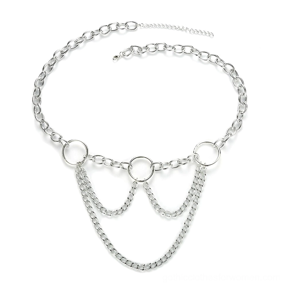 Flat lay display of layered statement chain belt with extended tail chain and circular ring accents on white background