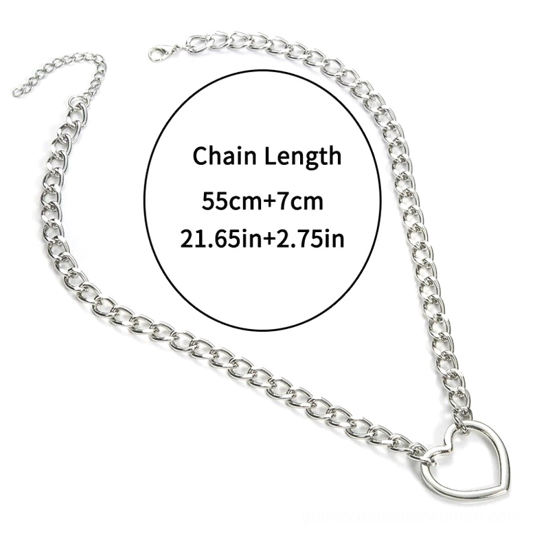 Silver hollow heart pendant necklace flat lay side view showing adjustable curb chain 55cm plus 7cm extension with secure lobster clasp, gothic alternative jewelry