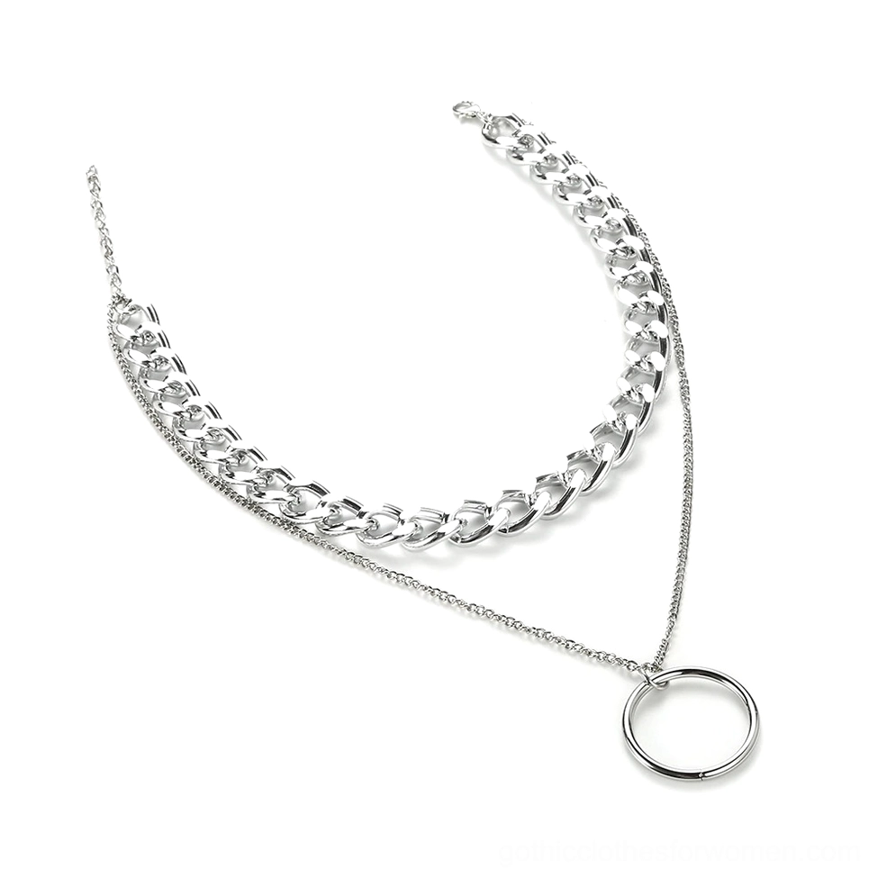 Silver hoop pendant necklace flat lay overhead view displaying metal shine and dual chain construction, alternative fashion jewelry