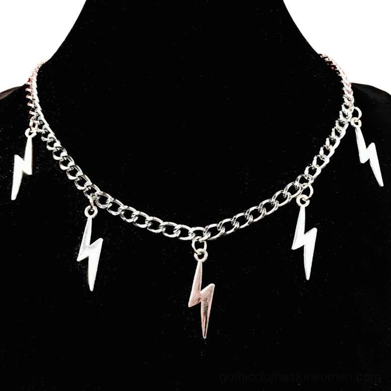 Silver lightning bolt choker necklace with multiple geometric pendants displayed on black jewelry mannequin, front view against dark background