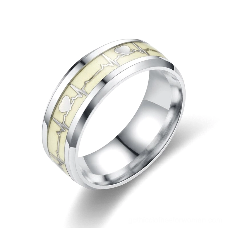 Silver luminous ECG heartbeat gothic ring, side profile displaying cream phosphorescent band with cardiac waveform and heart symbol