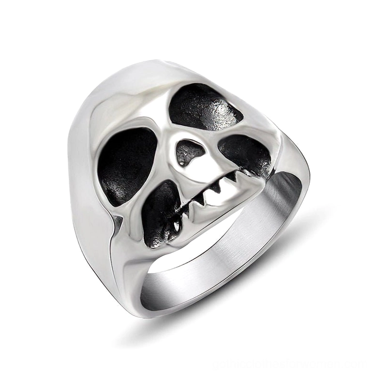 Polished silver stainless steel memento mori skull ring with intricate hollow eye sockets and fang teeth detail, 3/4 front studio view showcasing gothic punk statement jewelry