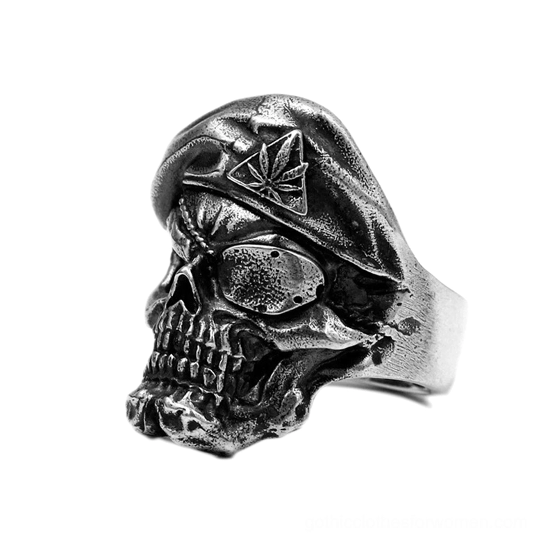 Side profile of vintage gothic skull ring displaying textured carving work and silver band width