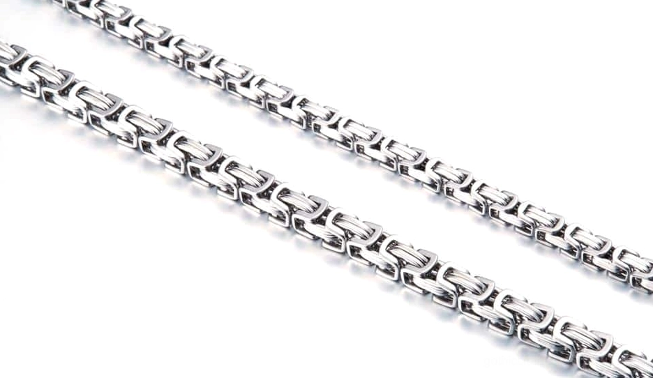 All silver twisted chain necklace flat lay - stainless steel biker gothic jewelry showcase
