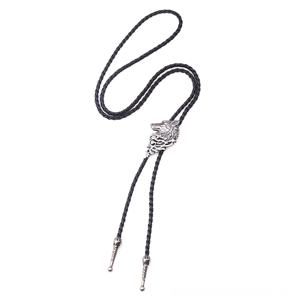 Silver wolf head gothic necklace pendant hanging vertically showing carved metal details and woven rope chain