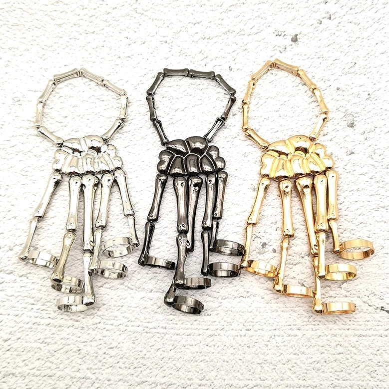 Multi-color skeleton hand slave bracelets in gunmetal black gold and silver showing all available color options