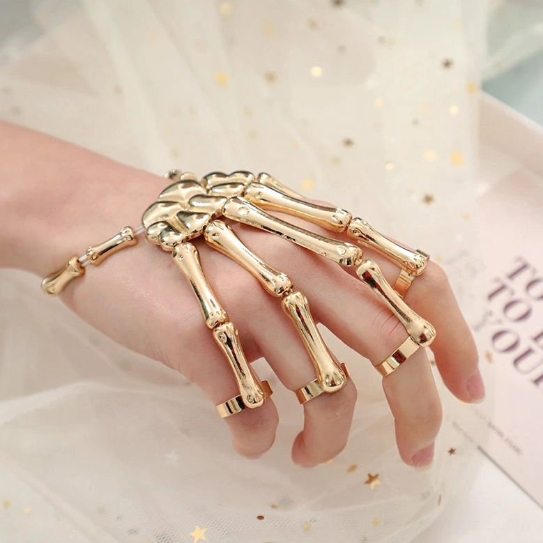 Skeleton hand slave bracelet styled view demonstrating gothic fashion aesthetic and versatile wear options
