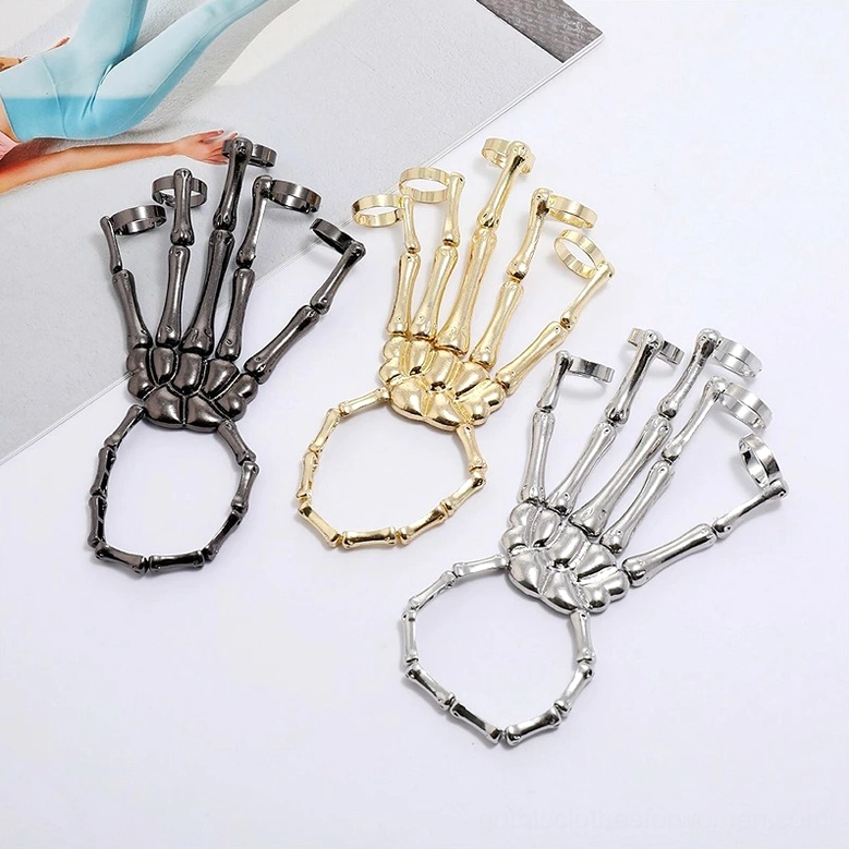 Three-color skeleton hand slave bracelets comparison gunmetal silver and gold color variants displayed together