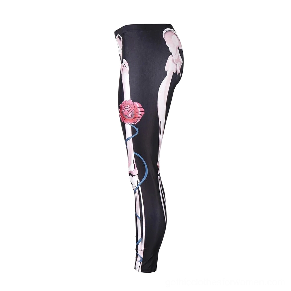Skeleton rose gothic leggings side flat lay - detailed view of rose vine print and black fabric texture