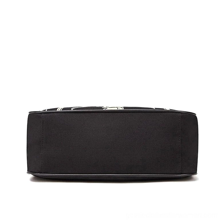Skeleton rib cage tote bag overhead top-down view - showing structured flat black canvas base and interior capacity