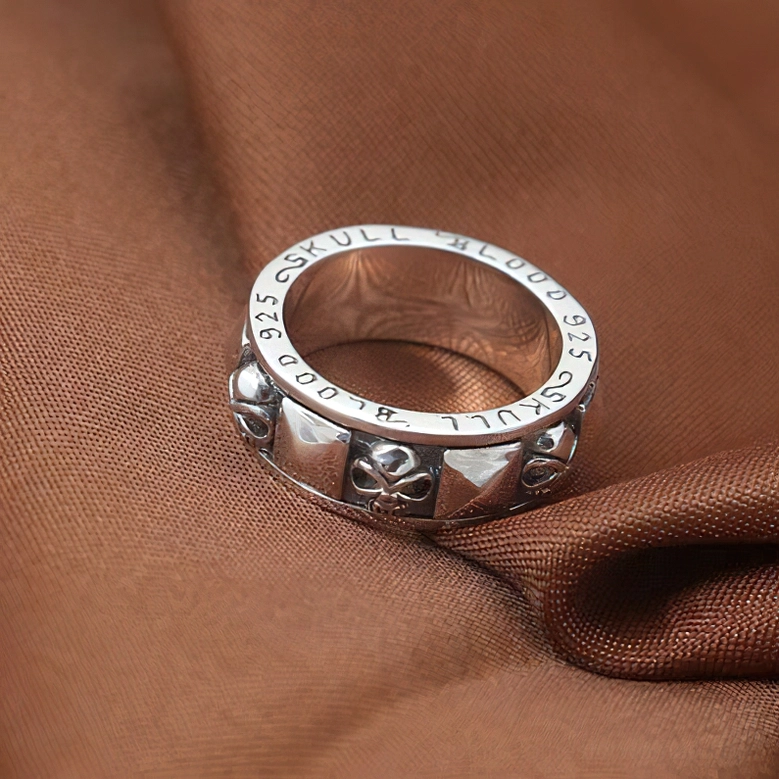 Engraved skull blood 925 sterling silver ring low angle view showing text inscription and craftsmanship