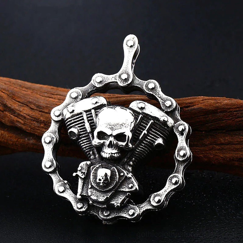 Skull engine gothic pendant necklace shot against wooden prop and dark background - showcasing embossed secondary skull detail on engine