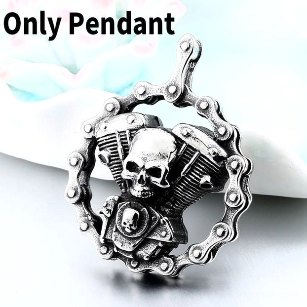 Close-up of standalone skull engine gothic pendant - twin motorcycle engine design with detailed embossed skull motif in stainless steel