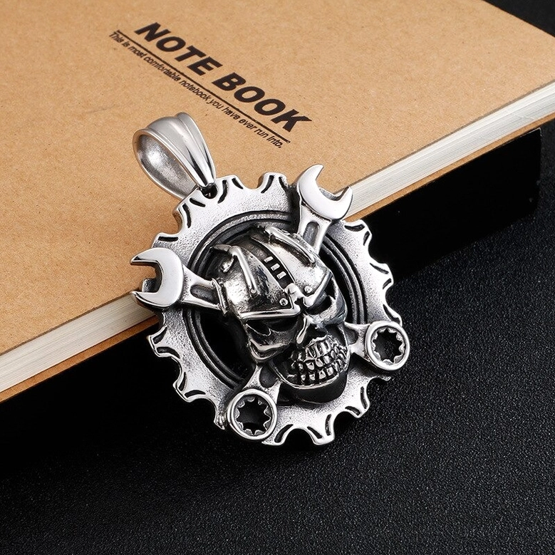 Mechanical skull pendant with gear frame - detailed front view of crossed wrenches and intricate design elements