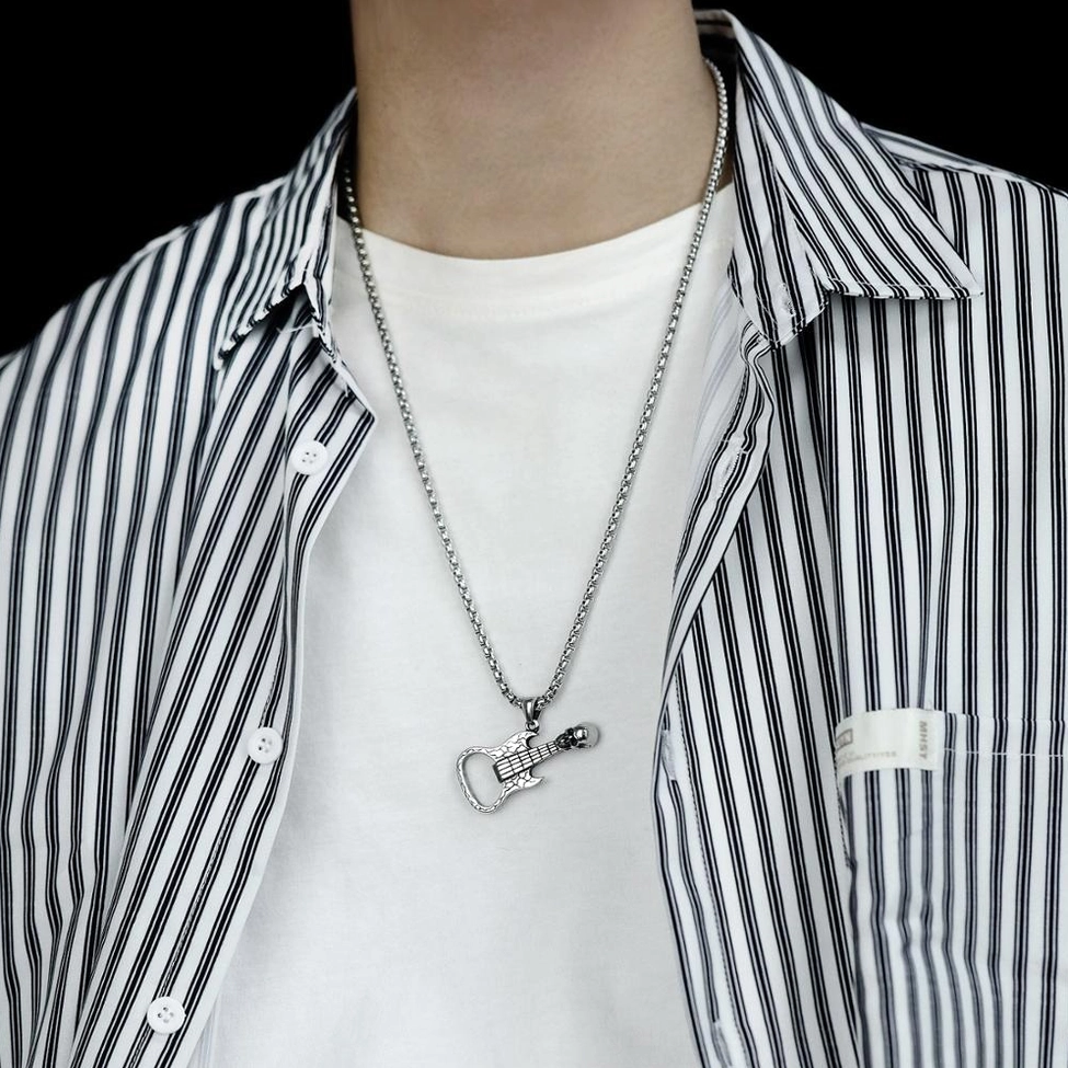 Men wearing skull guitar gothic necklace pendant on chest casual alternative style