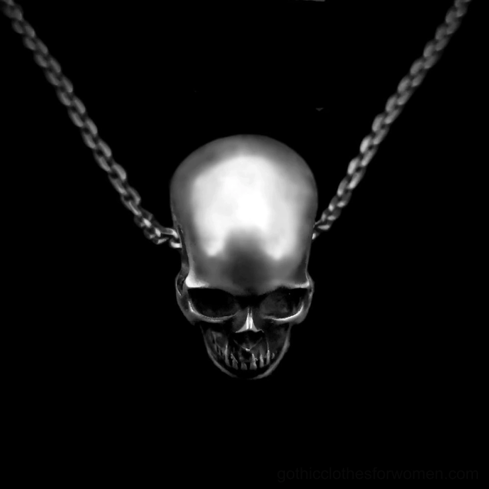 Polished silver skull pendant rear design displayed on black background showing streamlined back and gothic necklace chain