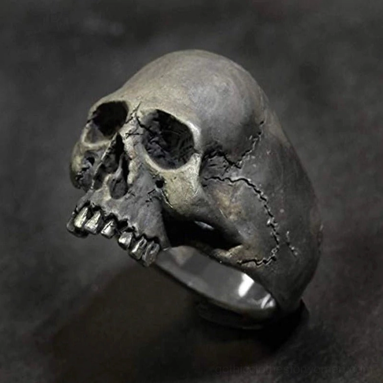 Detailed vintage skull ring with 3D anatomy design, left front oblique view on dark backdrop