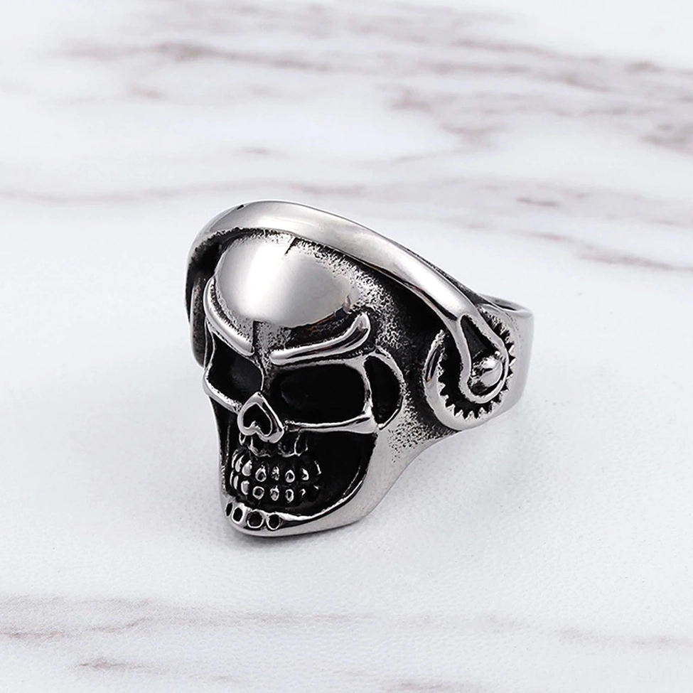 Detailed skull biker ring with engraved facial features and headphone decoration