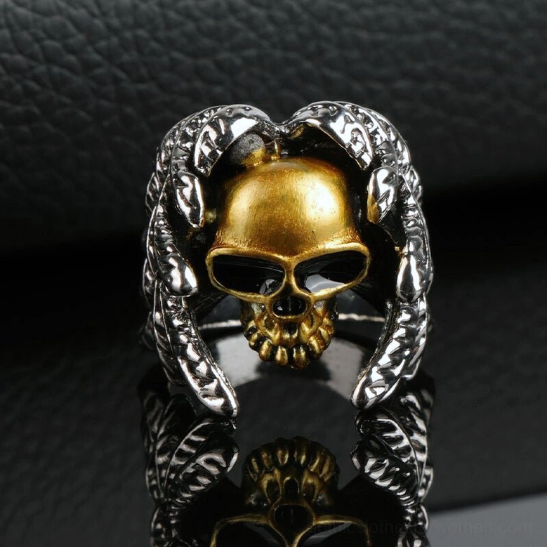 Reflective polished skull ring direct front view, dual-tone metal with clear feather and skull texture